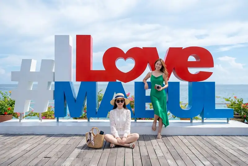 Famous photo spot at the I Love Mabul sign on Mabul Island Santiri Island Resort