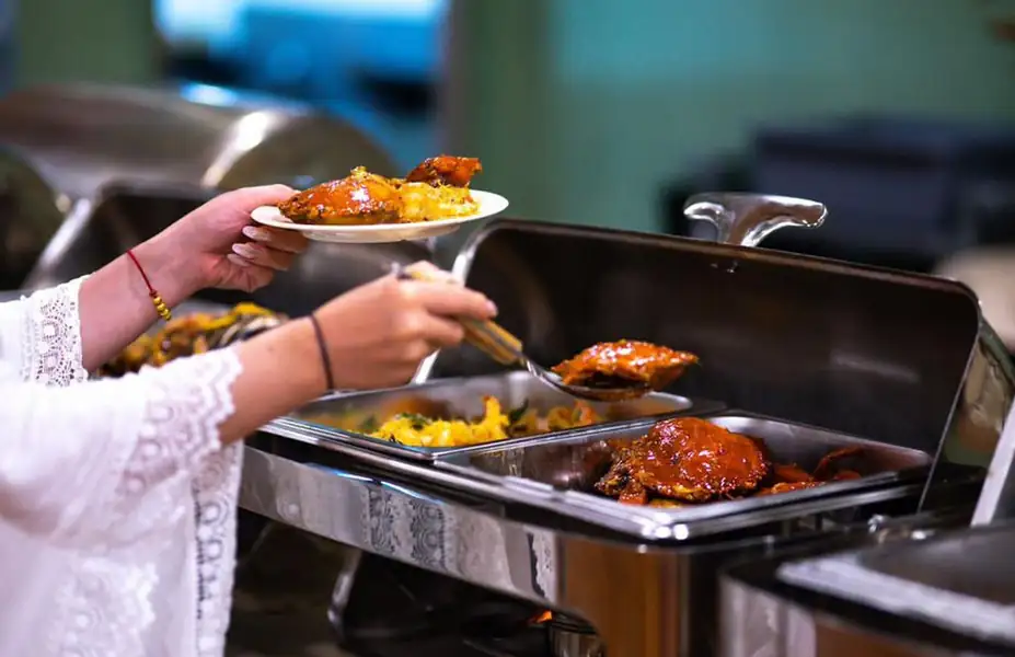 Large buffet food selection for resort guests Santiri Island Resort