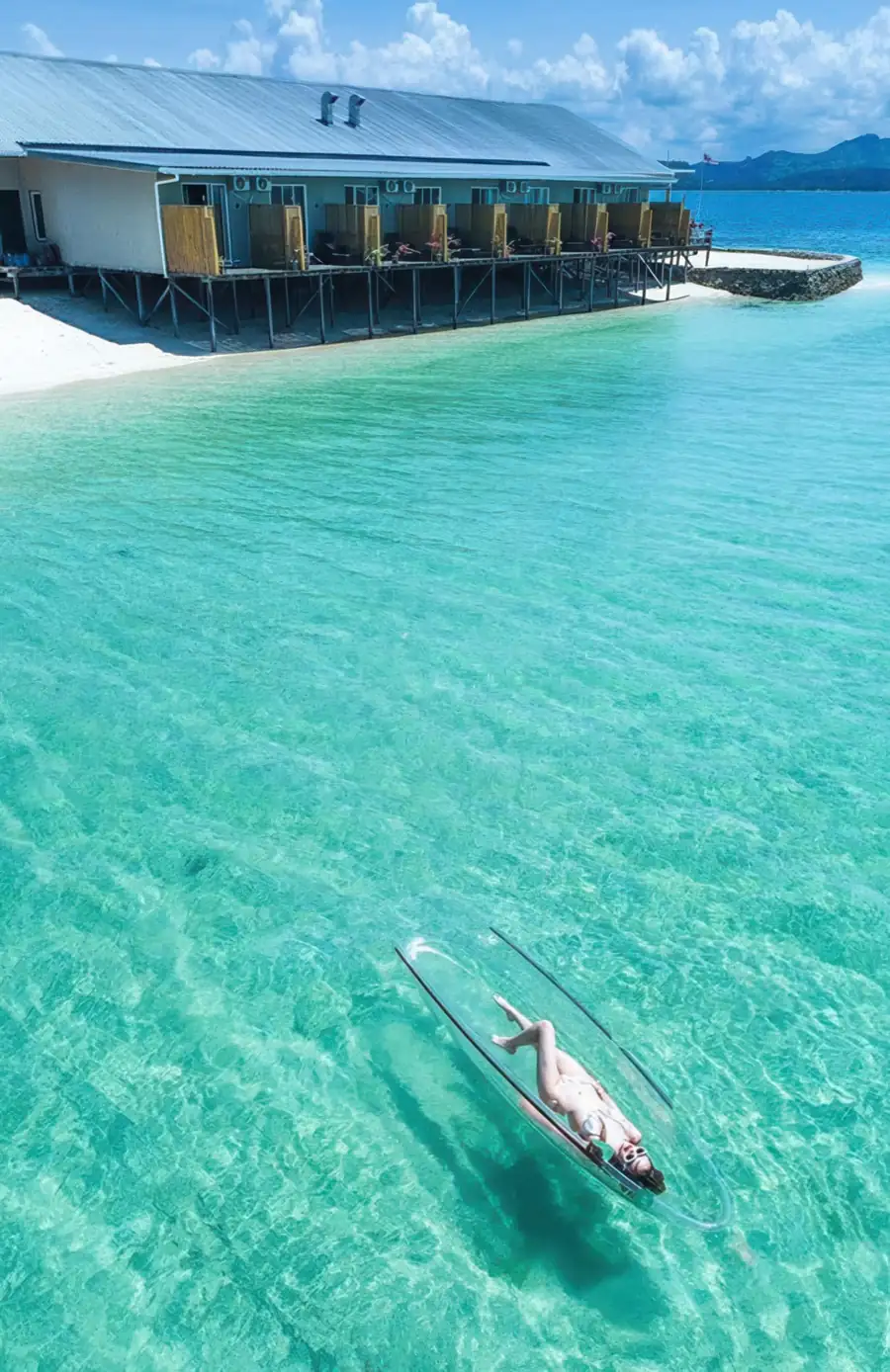 Guest enjoying a kayaking session in the calm sea Santiri Island Resort