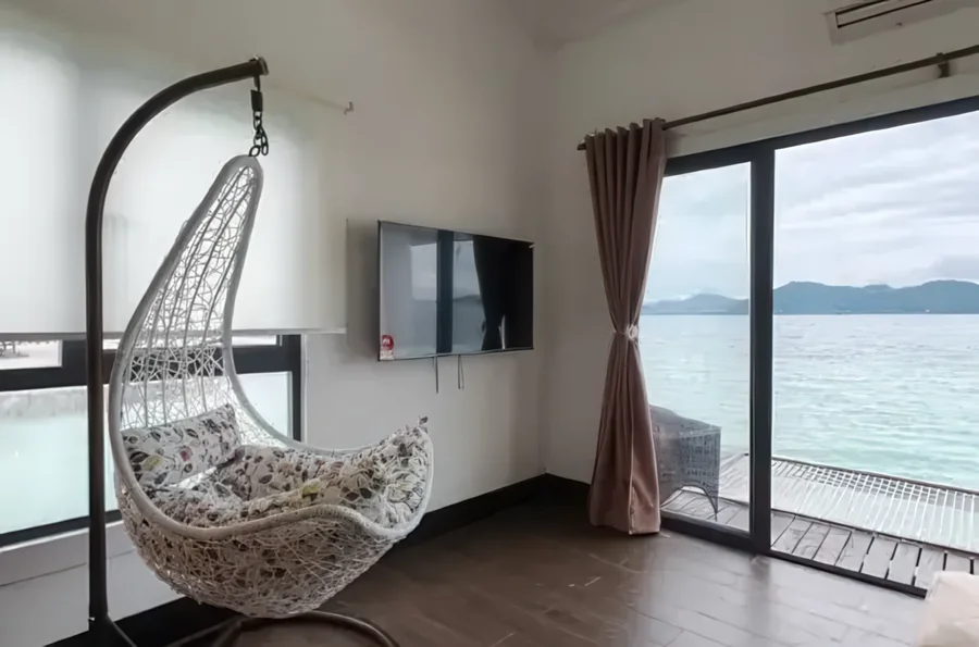 Water villa hanging chair balcony seaview - private island resort near Semporna